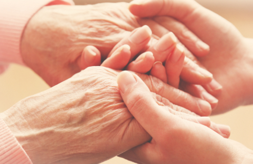 Young hands holding older hands