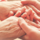 Young hands holding older hands