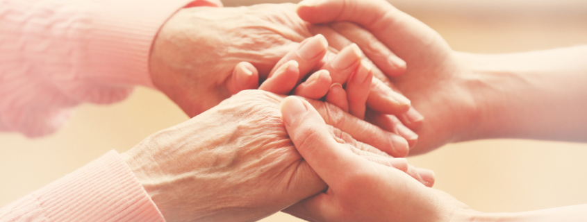 Young hands holding older hands