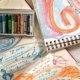 Drawings with writing on them along with pastels